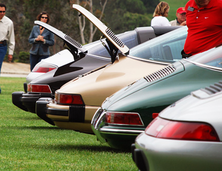 line-of-porsches-back-hoods-open-8511360